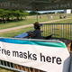 A U.S. Park Service Ranger preparing to distribute facemasks to people gathering near the Washington Memorial for Independence Day fireworks in Washington, DC on July 4, 2020.